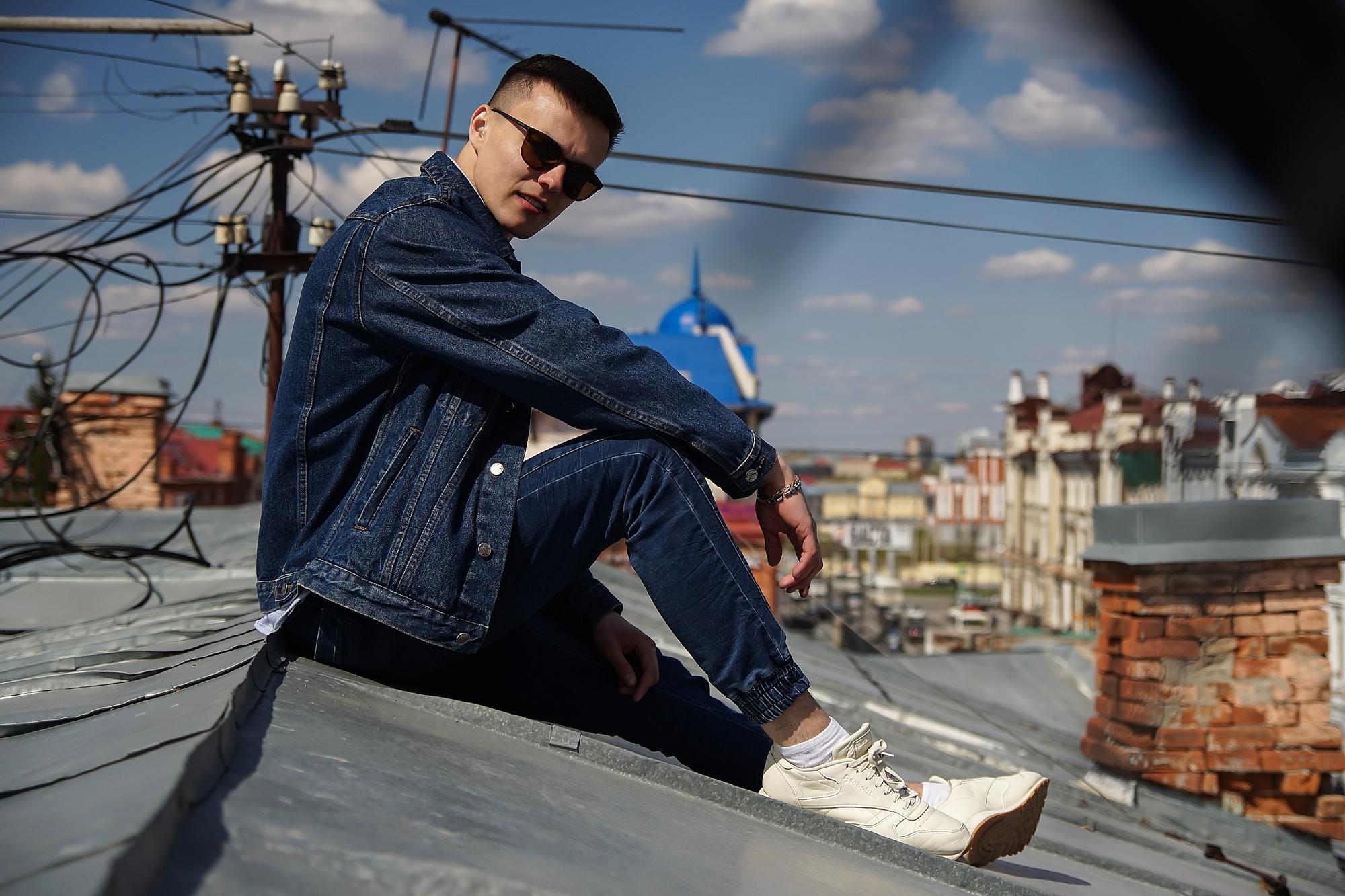 person wearing well fitted custom dark denim jeans